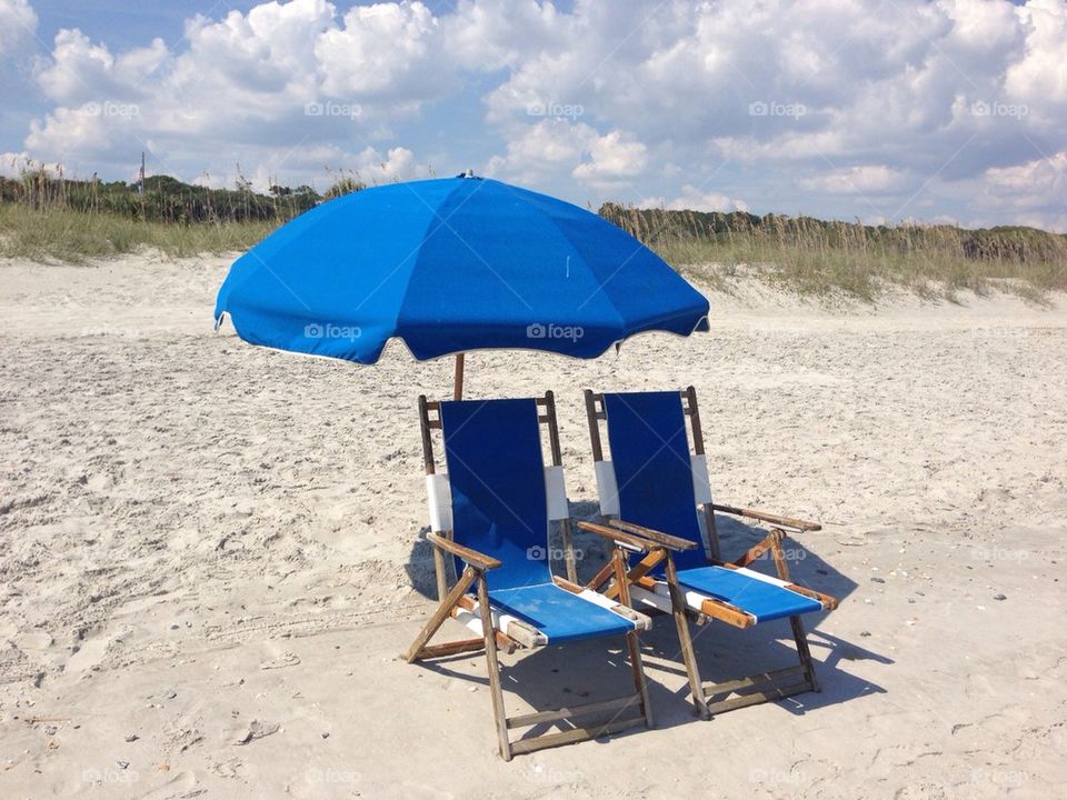 Beach chairs and umbrella