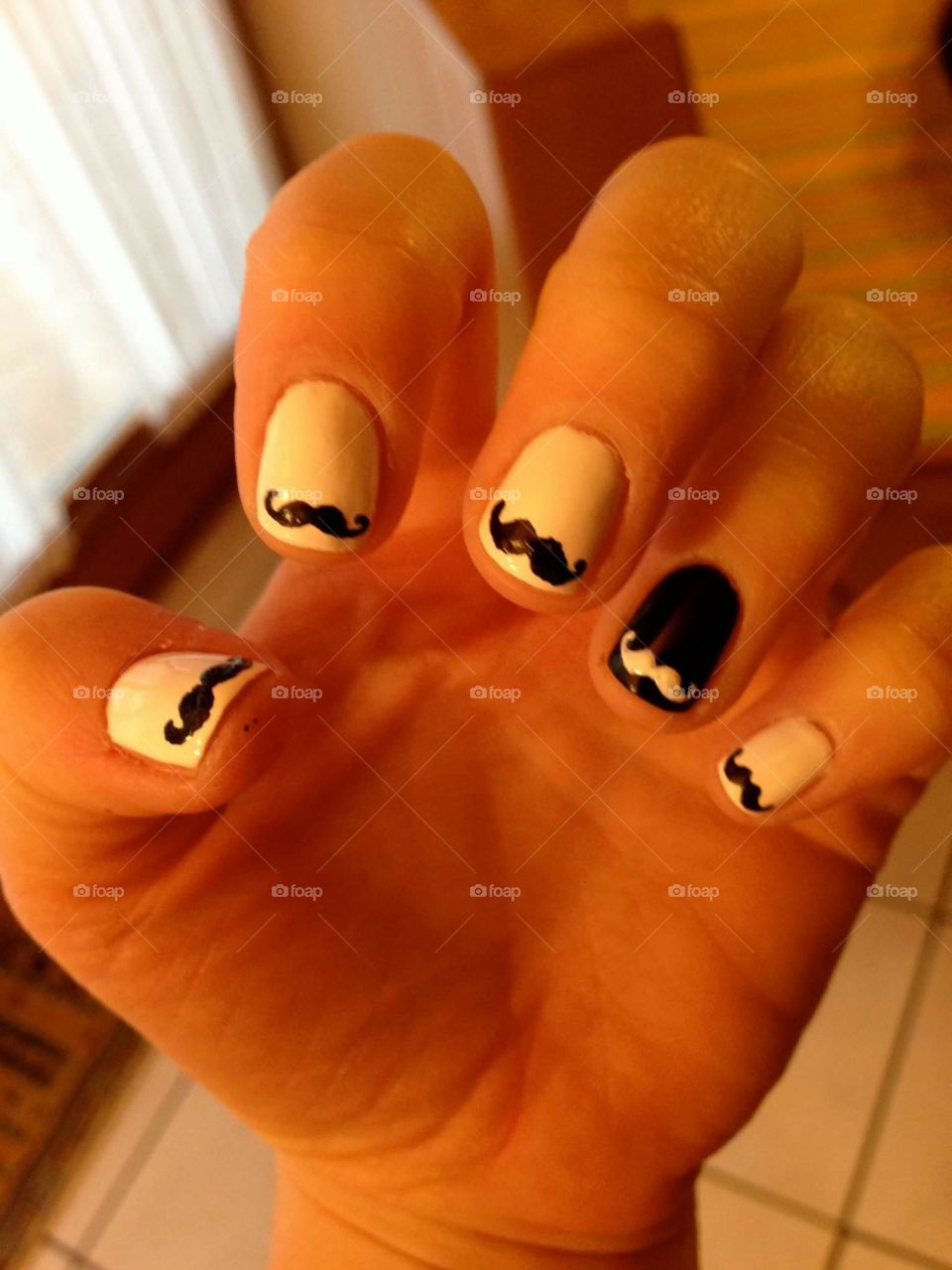 Simple white base with little mustaches on every finger.
