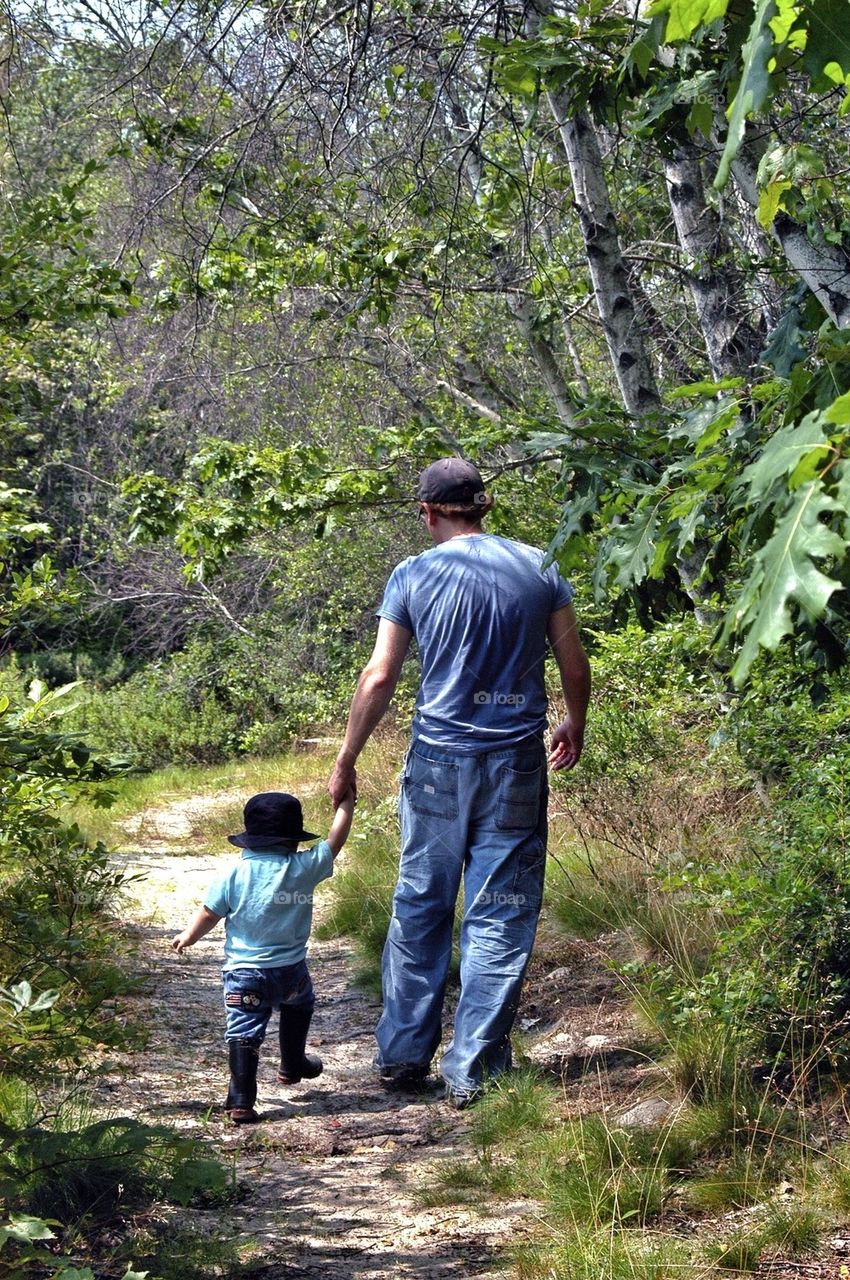 Daddy and son walking