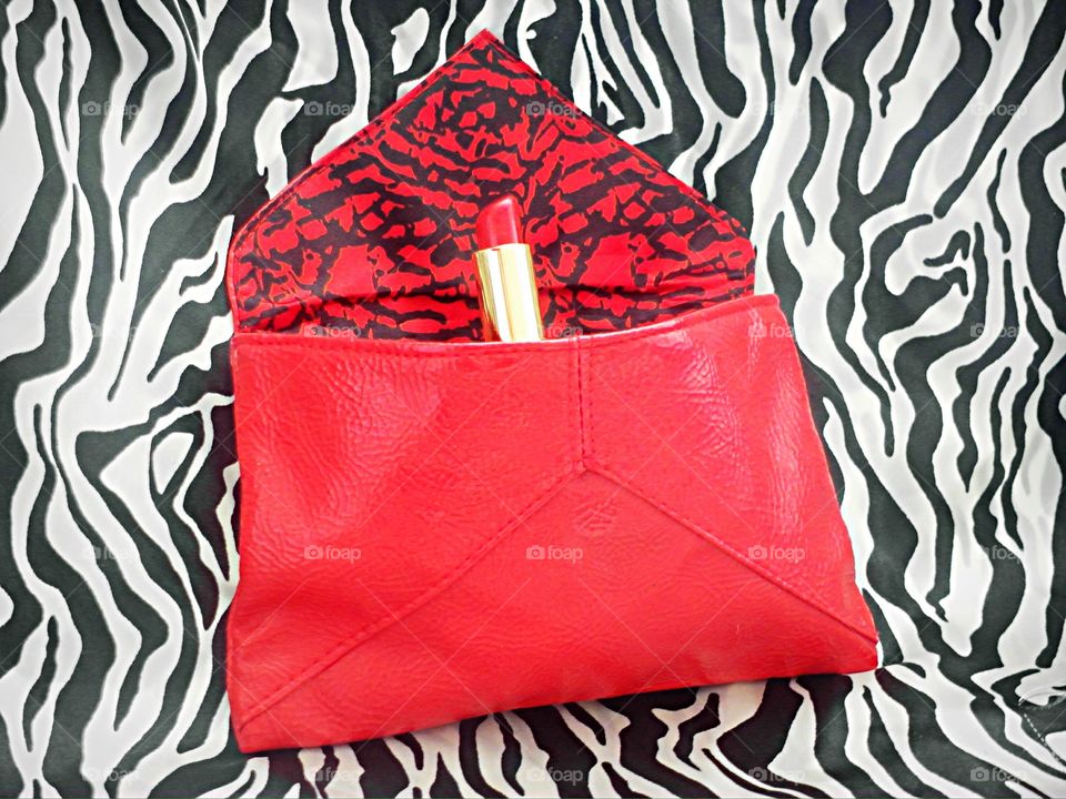 Red lipstick in red bag 