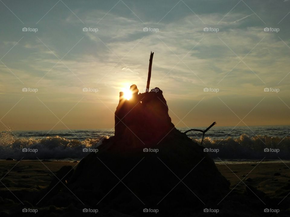 Sunset with sandcastle