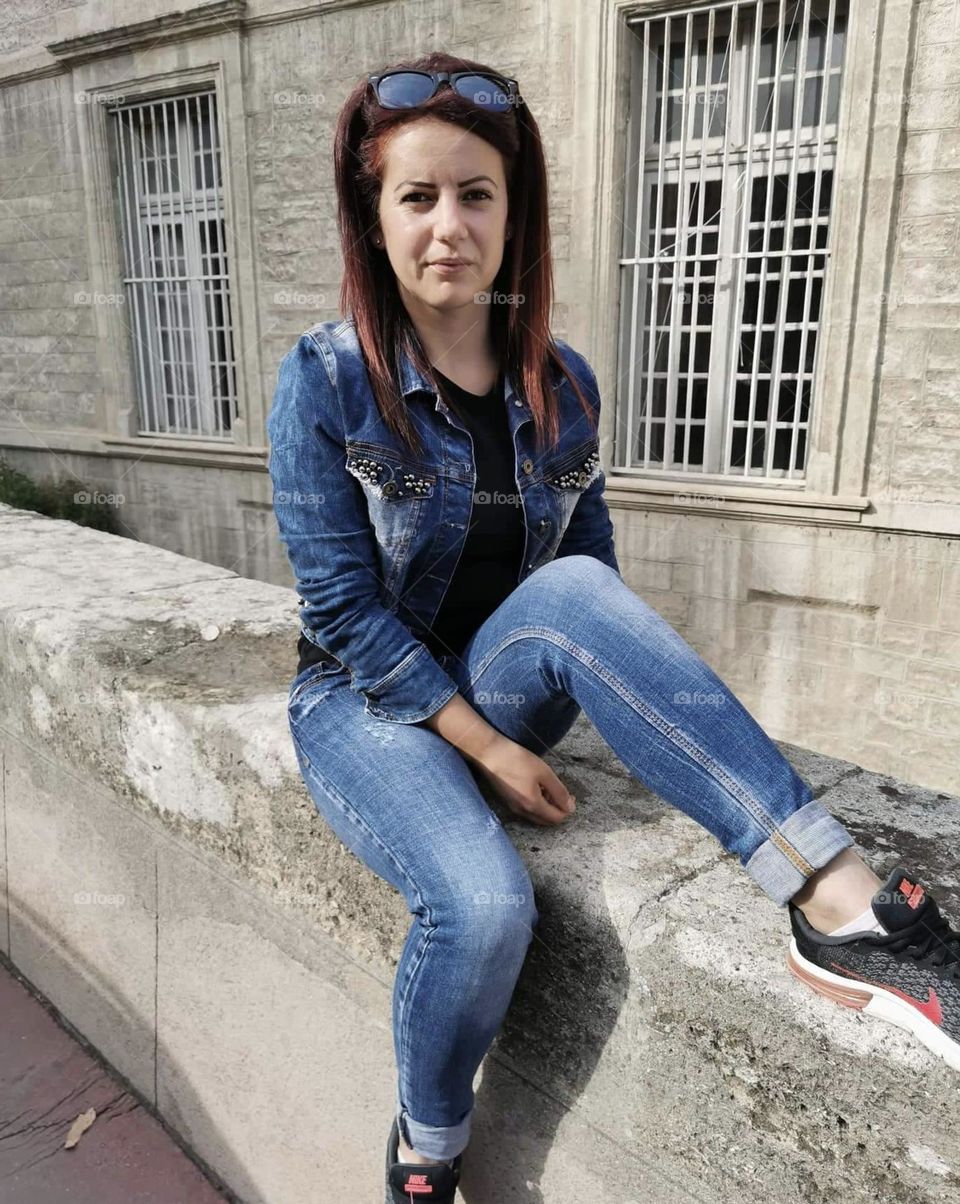 beautiful girl in front of university