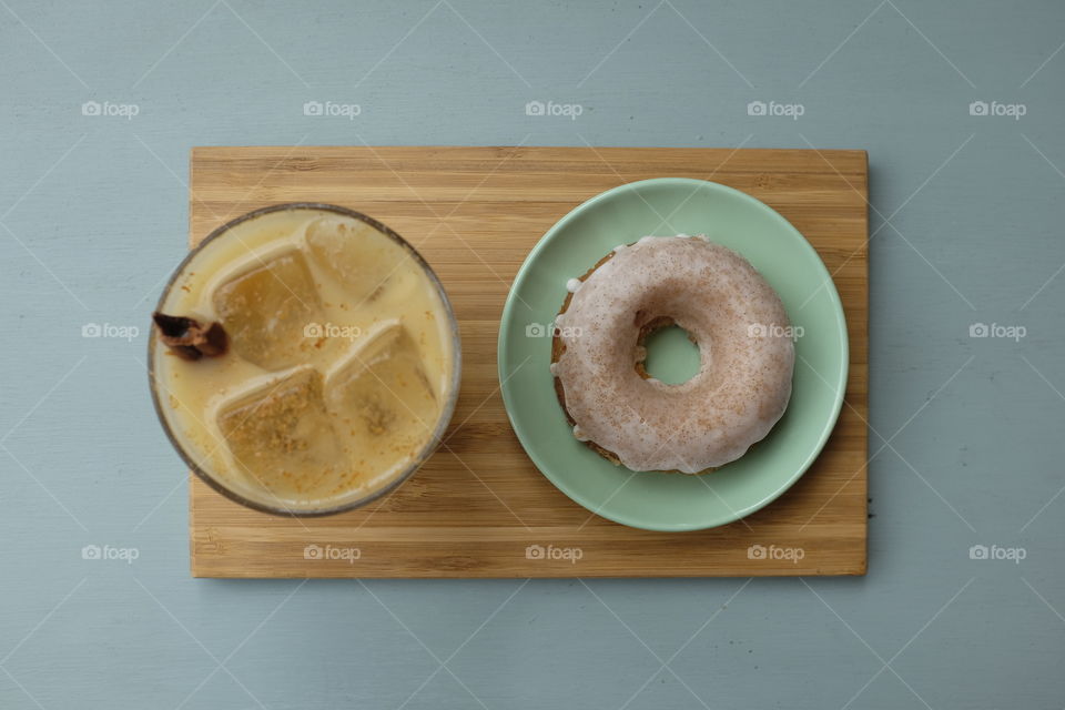 High angle view of coffee and donut