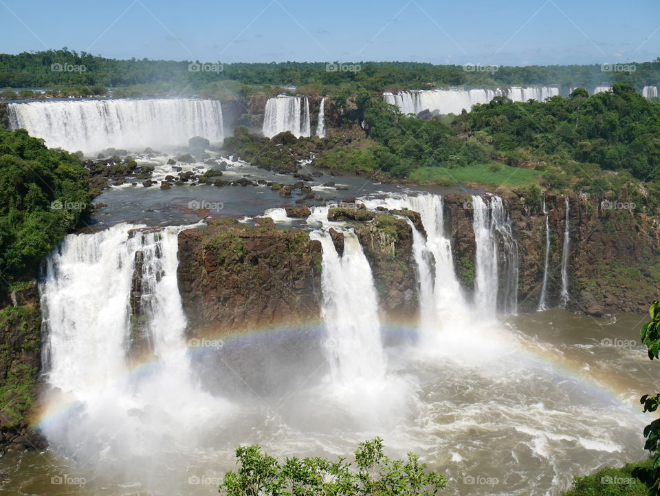 Rainbow over stunning Iguazu waterfalls in Brazil