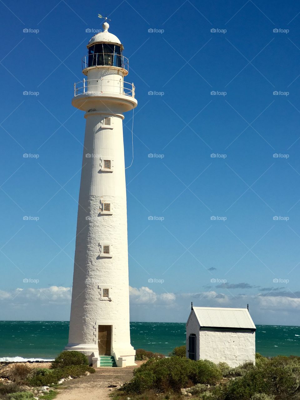 Old White lighthouse on a clear vivid blue day in south Australia; Point Lowly on the Eyre Peninsula in the Spencer Gulf. See my portfolio for more lighthouse photos