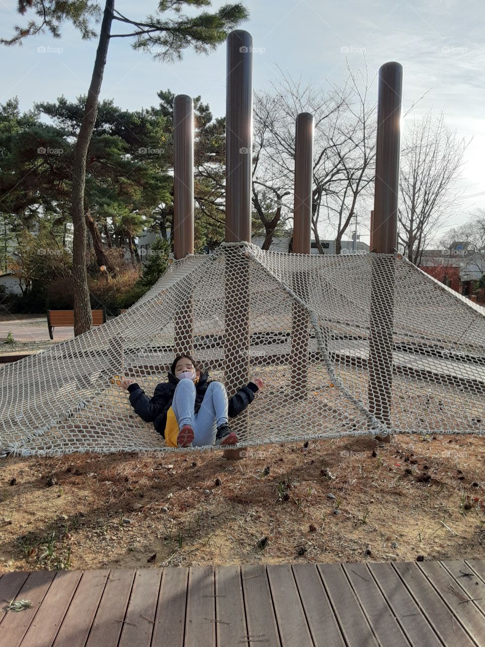 enjoying with my girl in this very beautiful place she think its her bed that she keep laying down on it. its really so soft and feels so good with the fresh air around us and the bird sounds on the air.