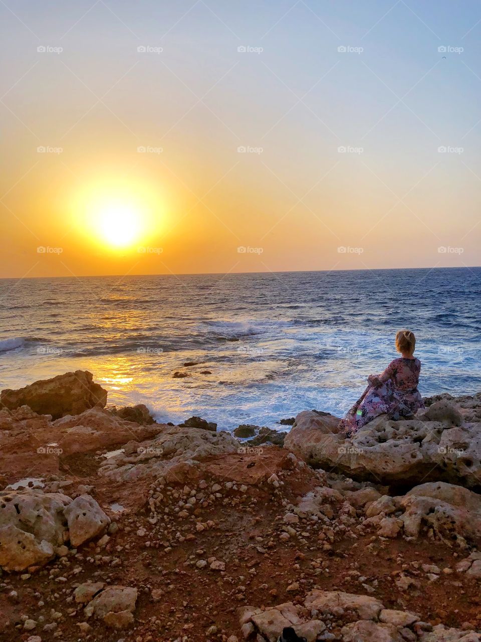 girl looks at the sunset