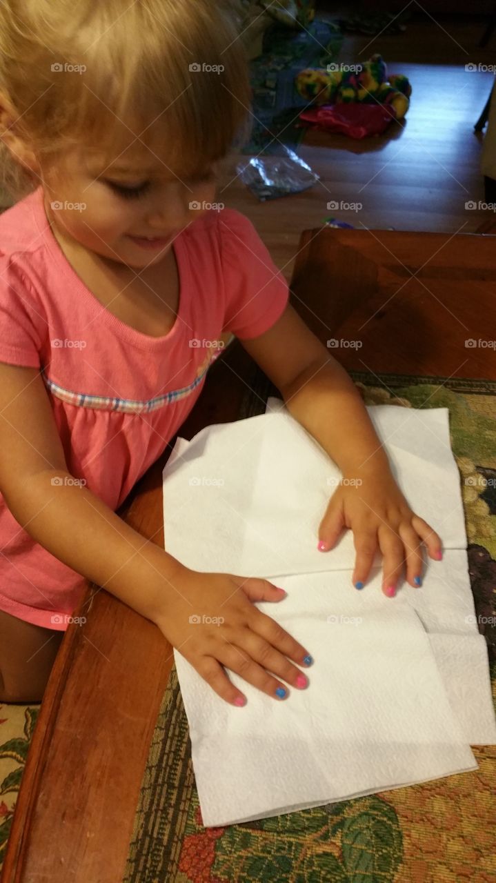 Cute girl with craft paper