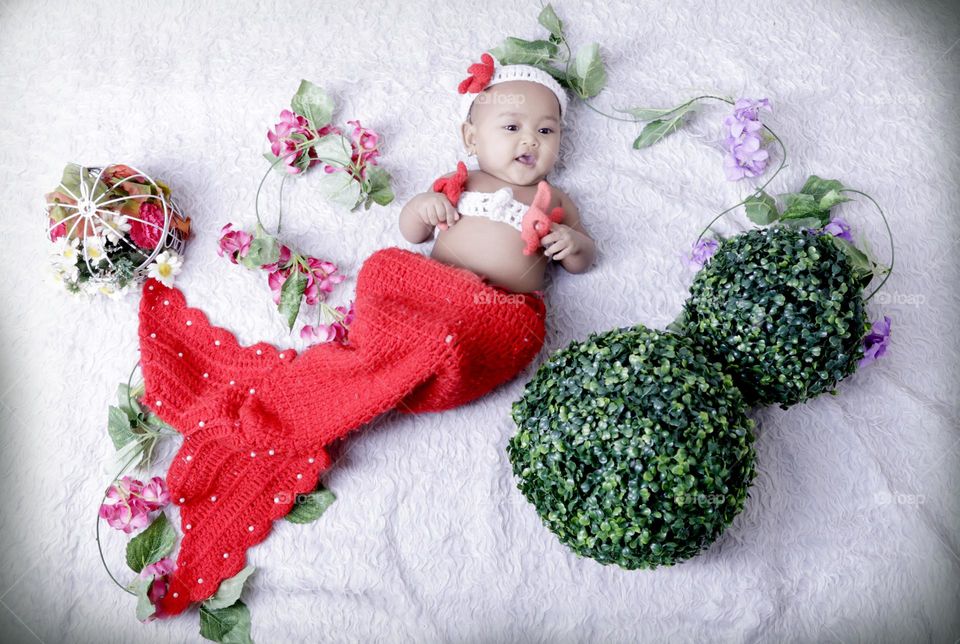 Baby mermaid on white background