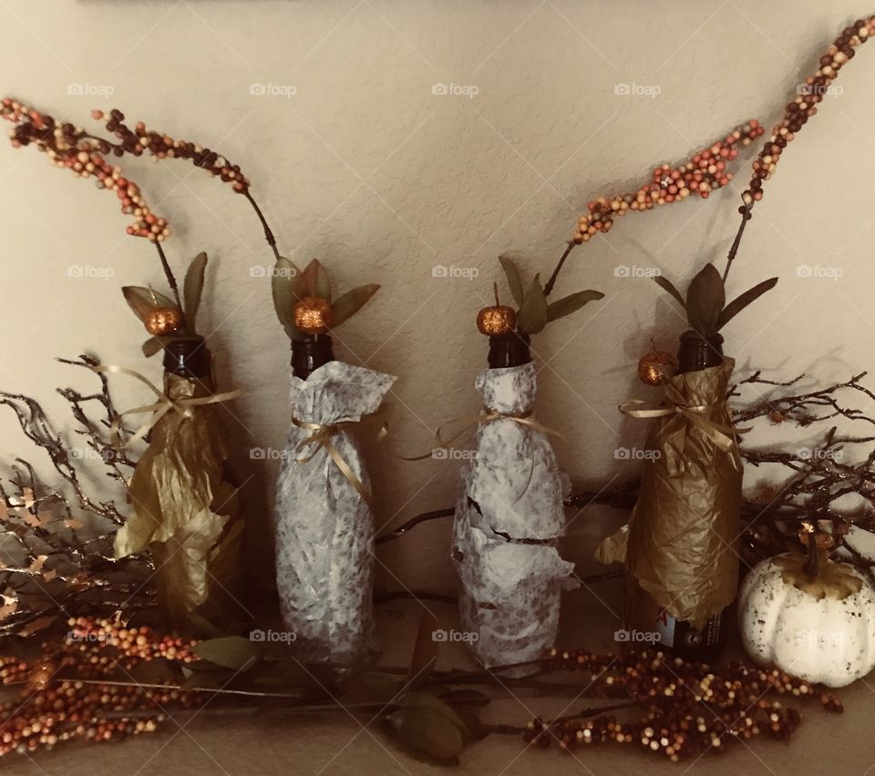 A rustic and vintage holiday display in the home of berries and orange glittery pumpkins 