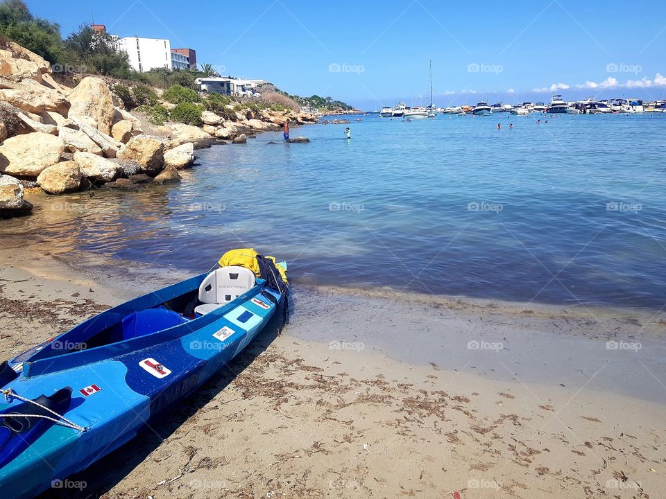 Kayak on mellieha beach in Malta on a hot sunny day