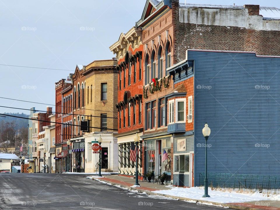 A desolate downtown area in a small rural town in New England sits lonely on a freezing winter morning