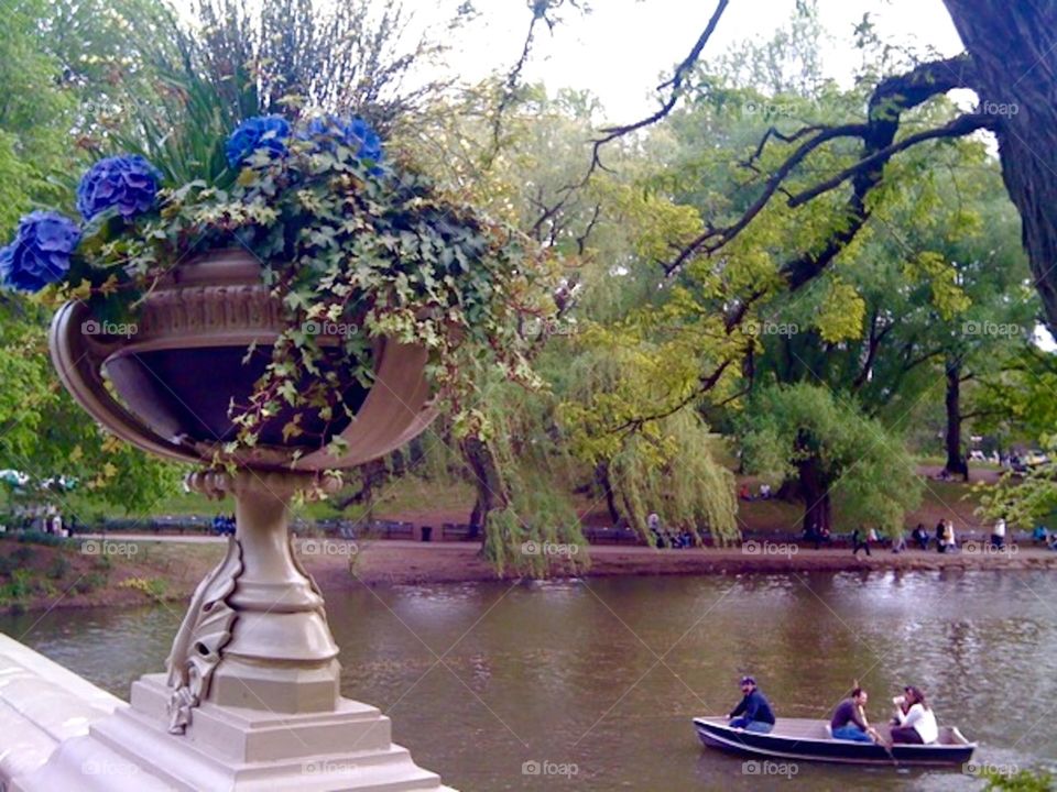 Central Park boaters. Boaters drift amongst the grandeur of beautiful Central Park
