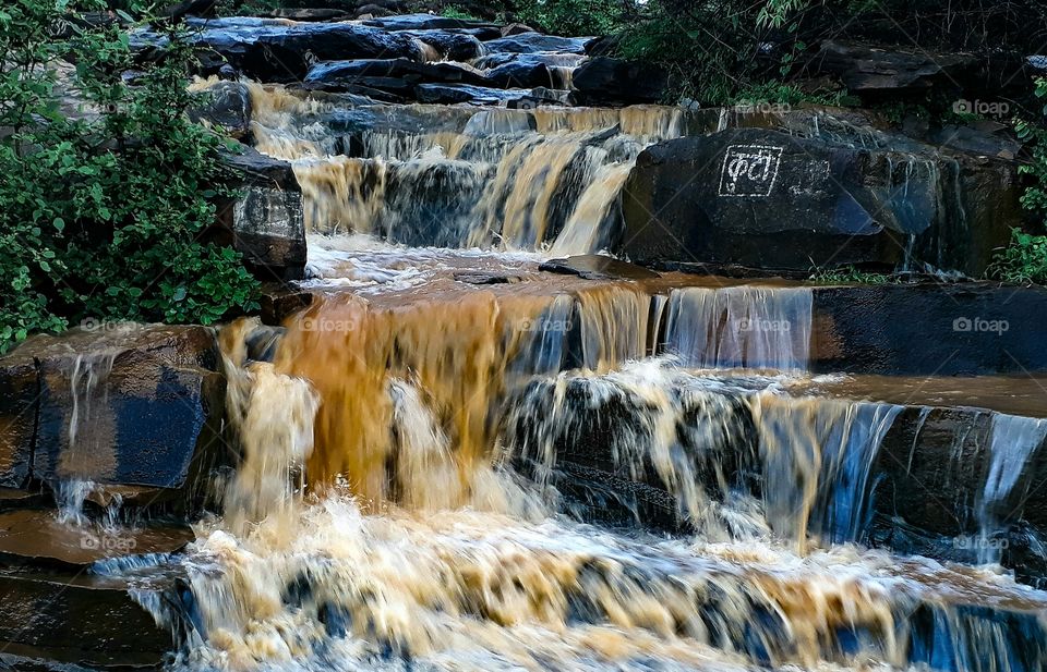 colors of water in a seasonal waterfall