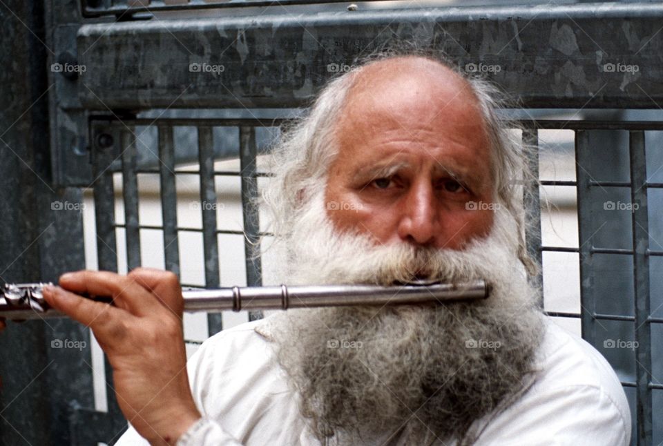 Man on a flute near Ground Zero. Near World Trade Center 