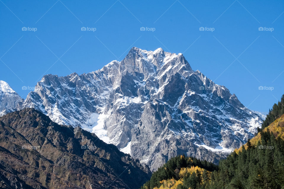 Beautiful landscape of autumn season on blue sky background in Georgia countryside