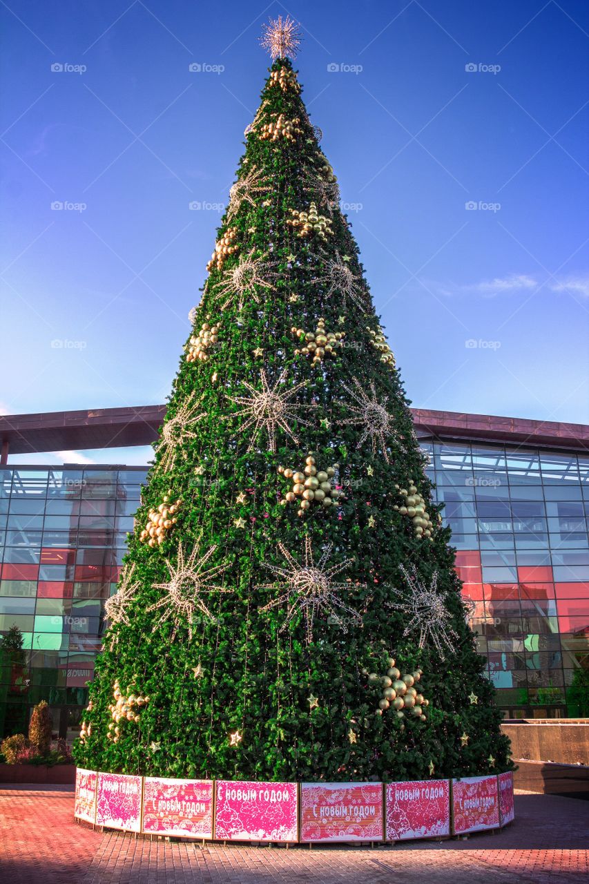 Artificial Christmas fir tree near the shopping centre in Moscow