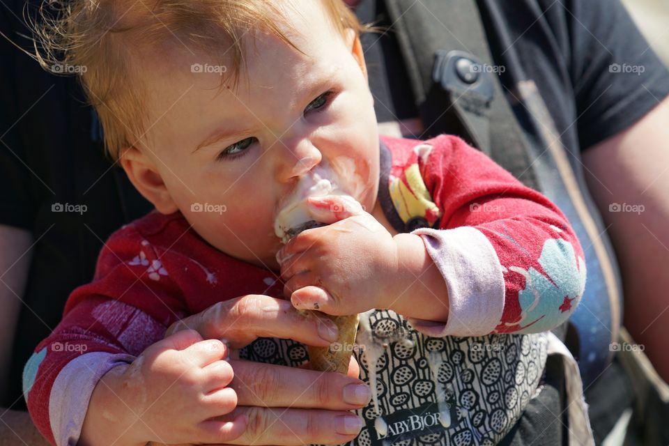 Baby Girl Trying To Eat A Vanilla Ice Cream Cone