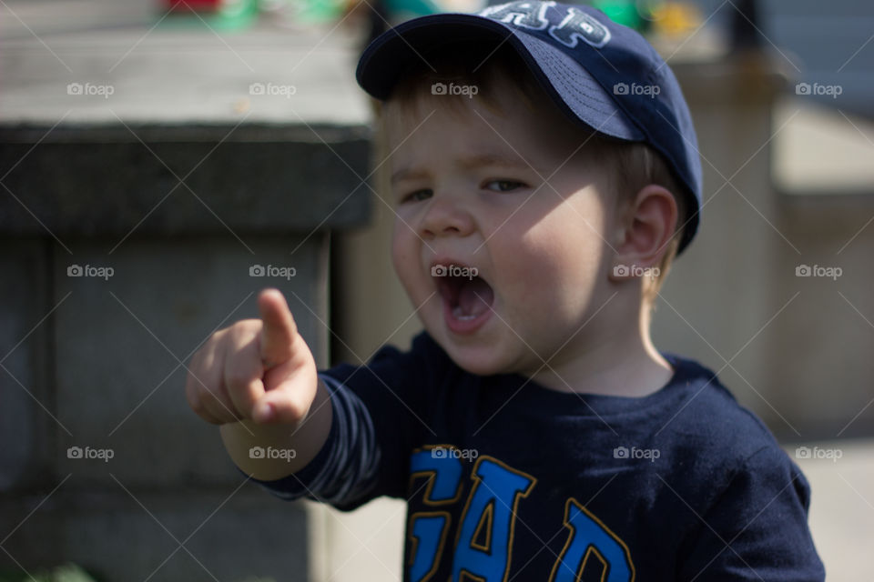 Close-up of angry boy gesturing