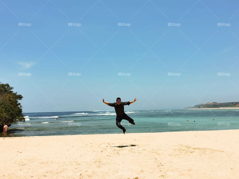 jump and have fun on the beach in Bali