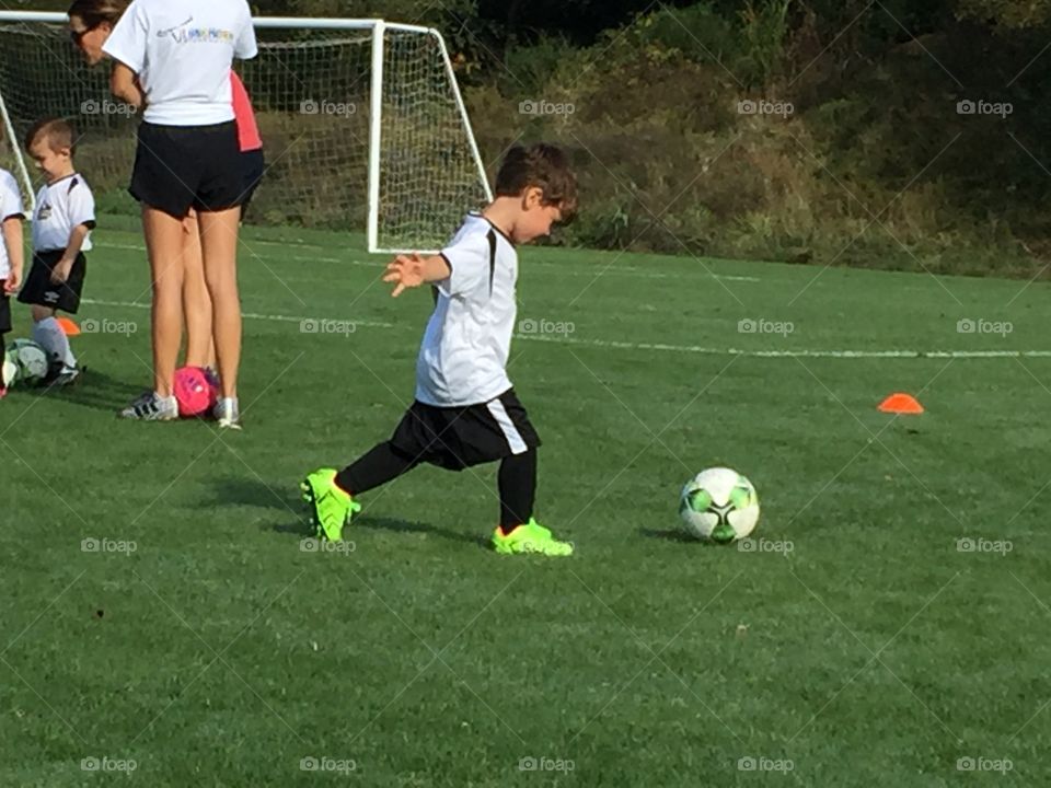 Boy playing soccer