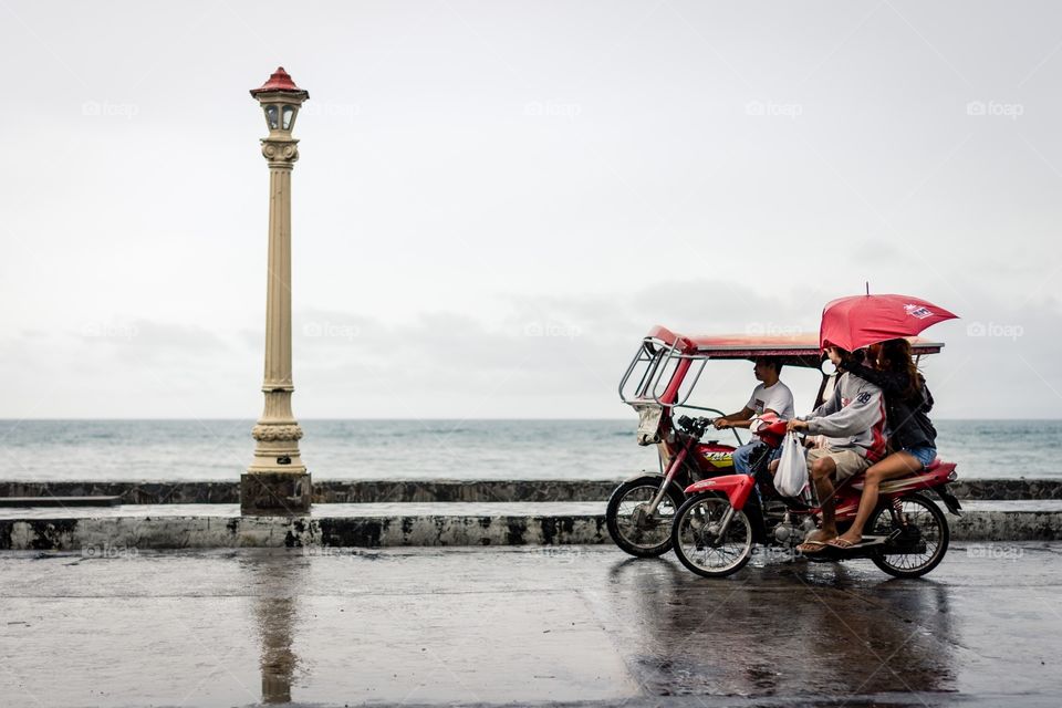 Rainy sea front day and basic transport. 