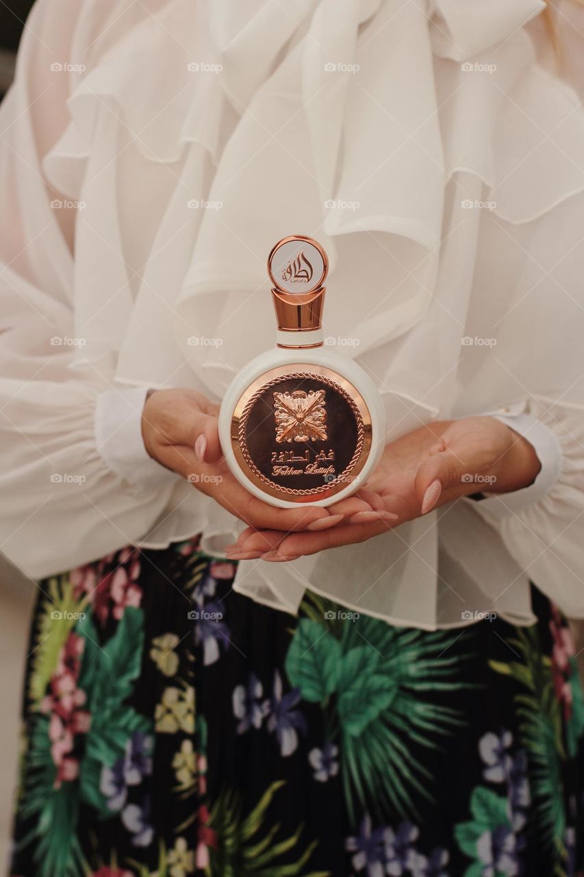 Favorite perfume in hand