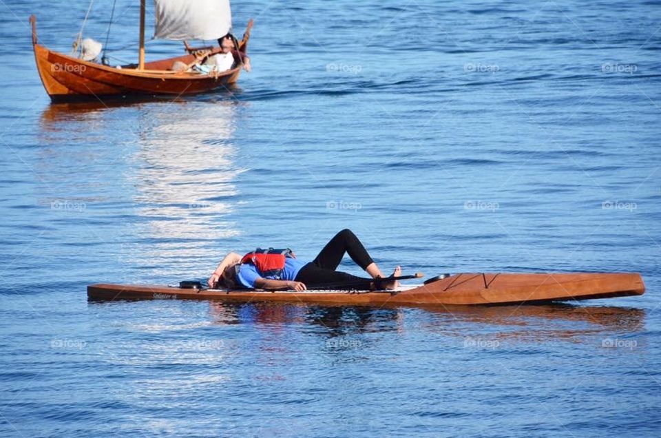 Relaxing on a paddle board in the bay