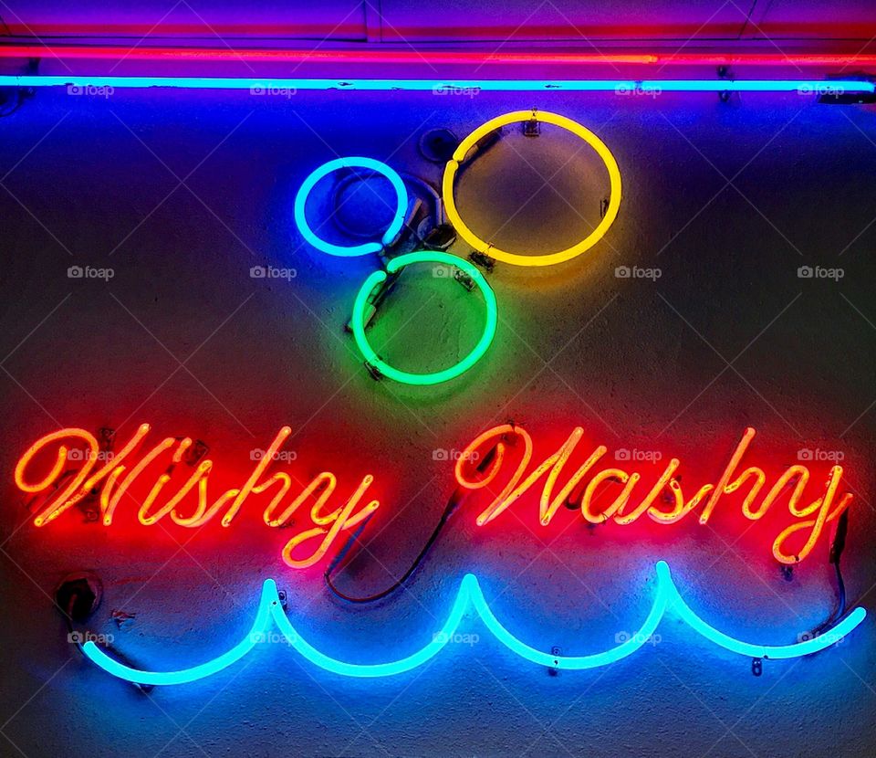 Wishy Washy. Wishy washy laundromat's neon sign at night.