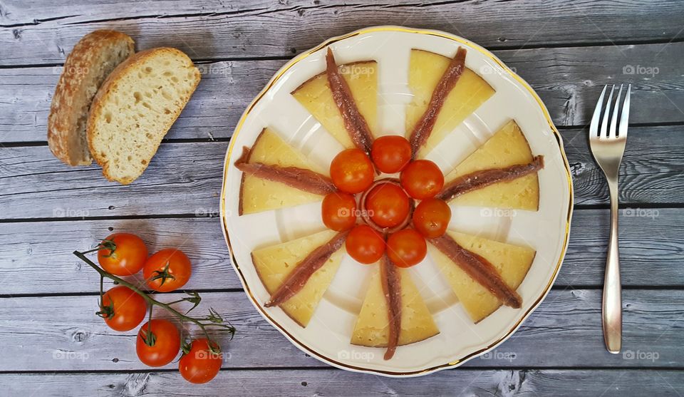 Sweet cake with cherry tomato