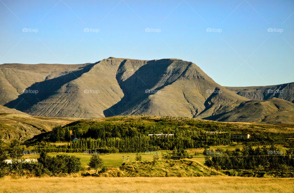 Brown mountain against clear sky