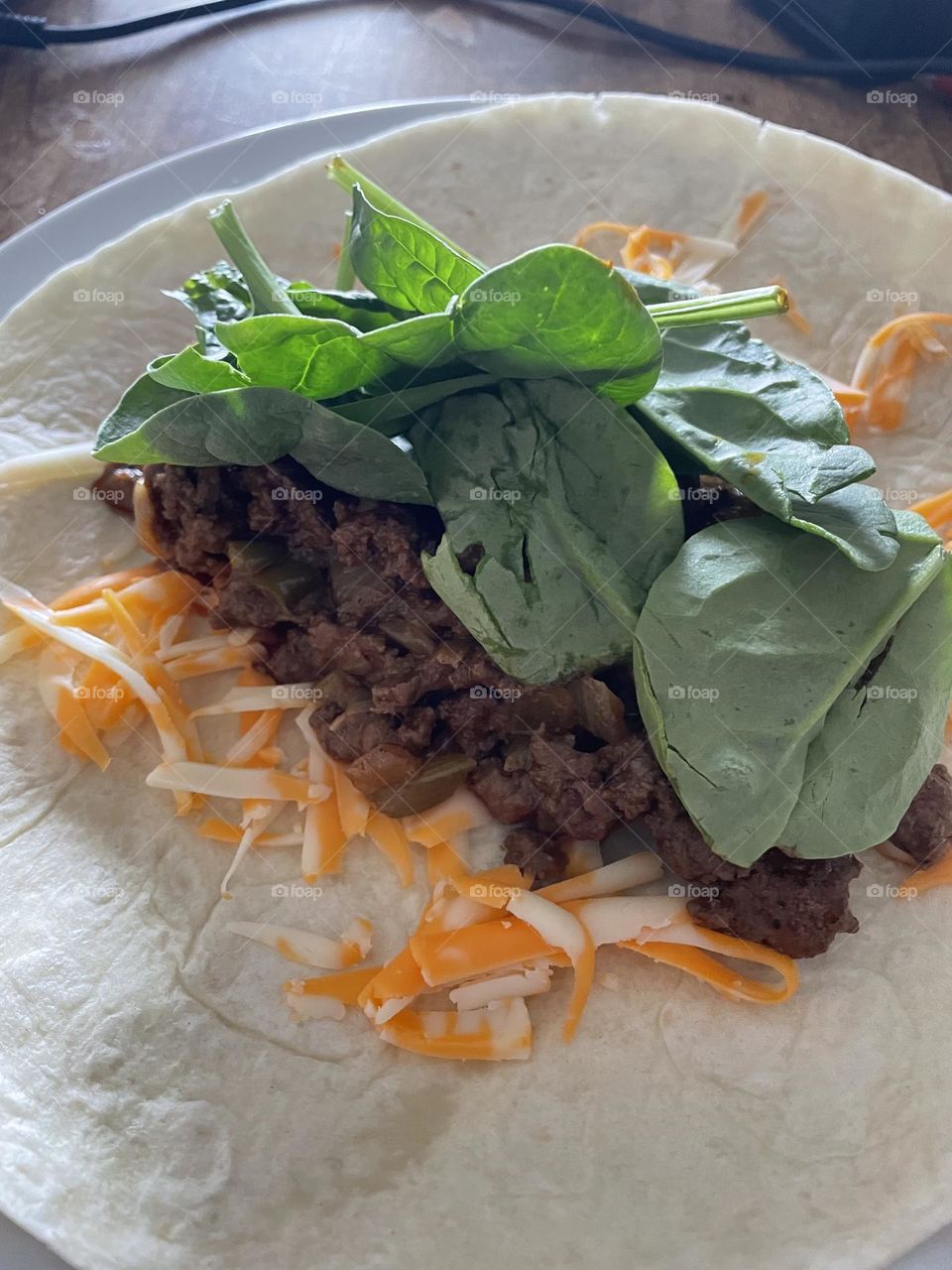 Delicious homemade cheese spinach beef soft taco