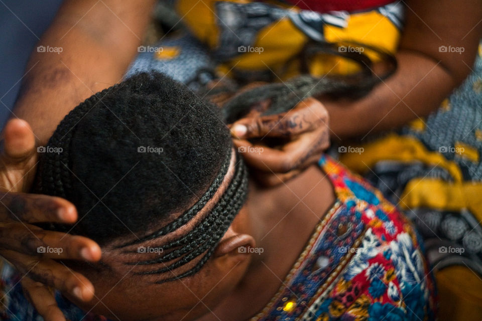 weaving braids in Tanzania