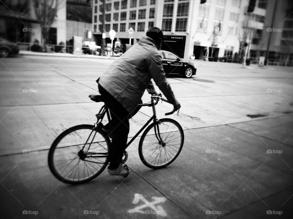 Riding a Bike in a Coat