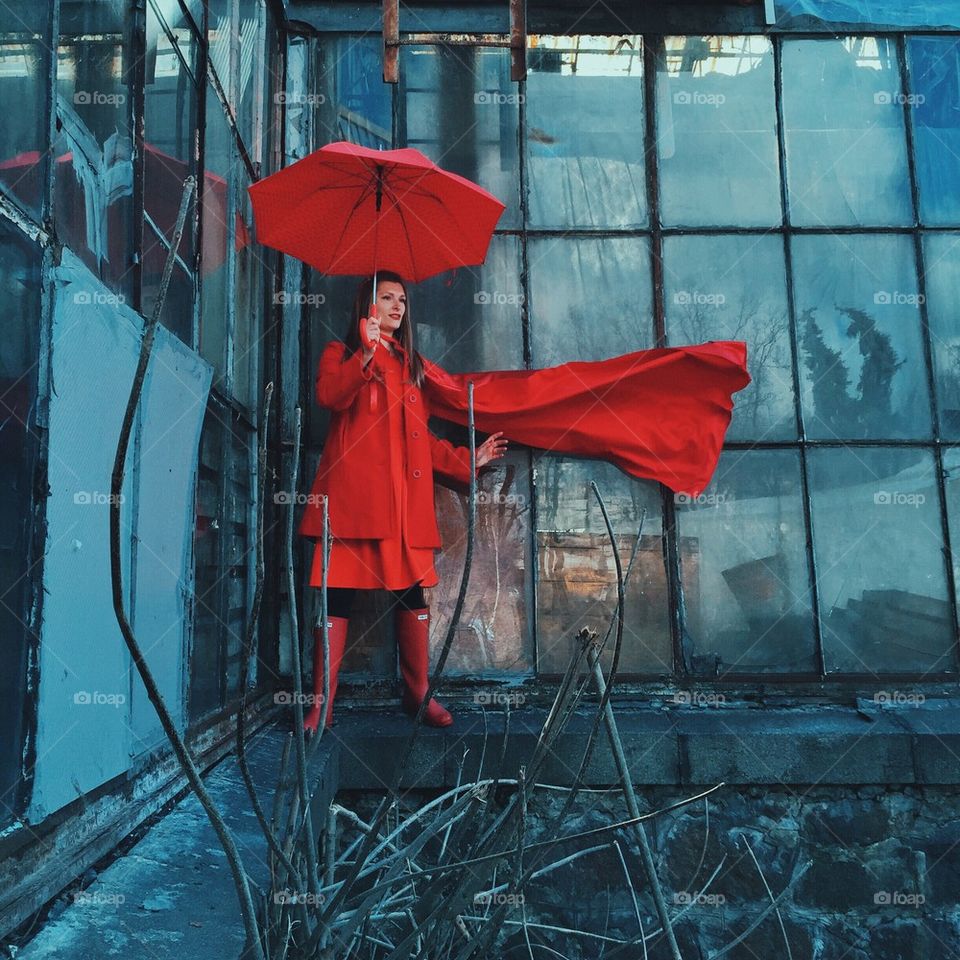 Superwoman in red with umbrella