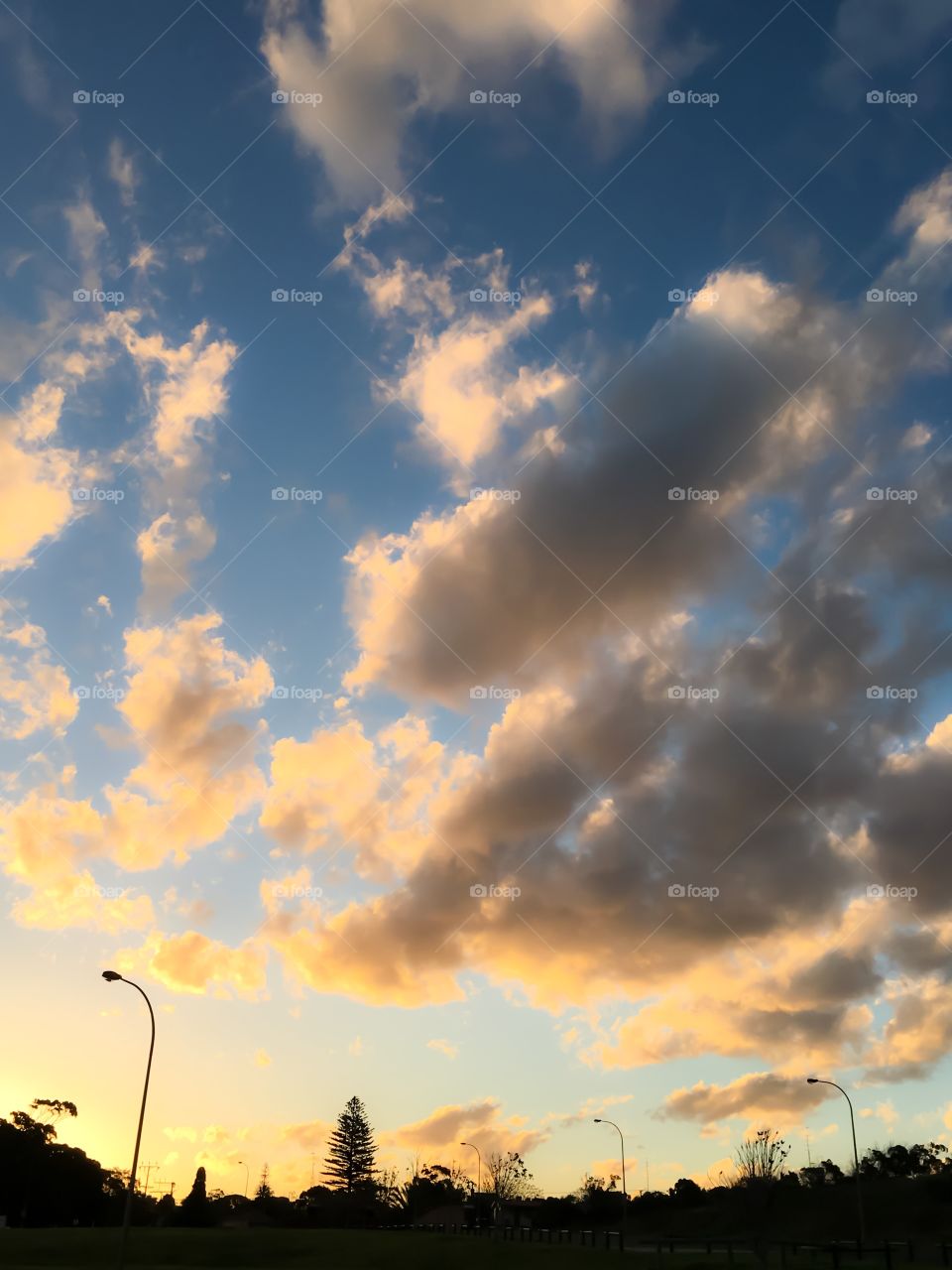 Golden hour clouds and silhouette