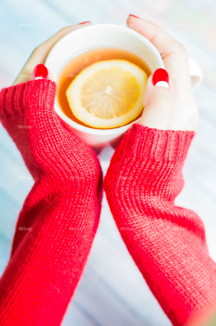 woman hand with cup of tea