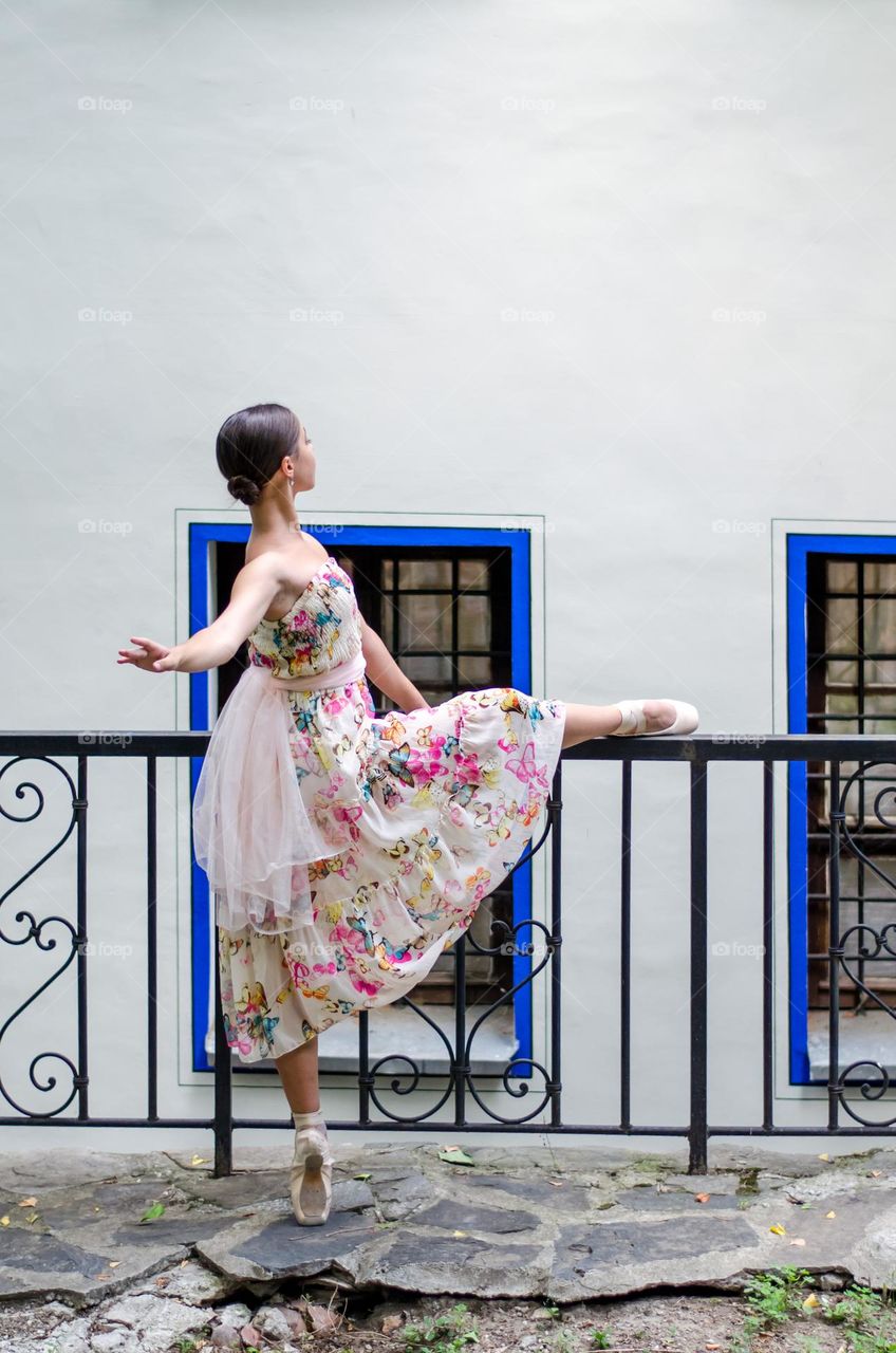 Young Female Ballerina Dancing Outside