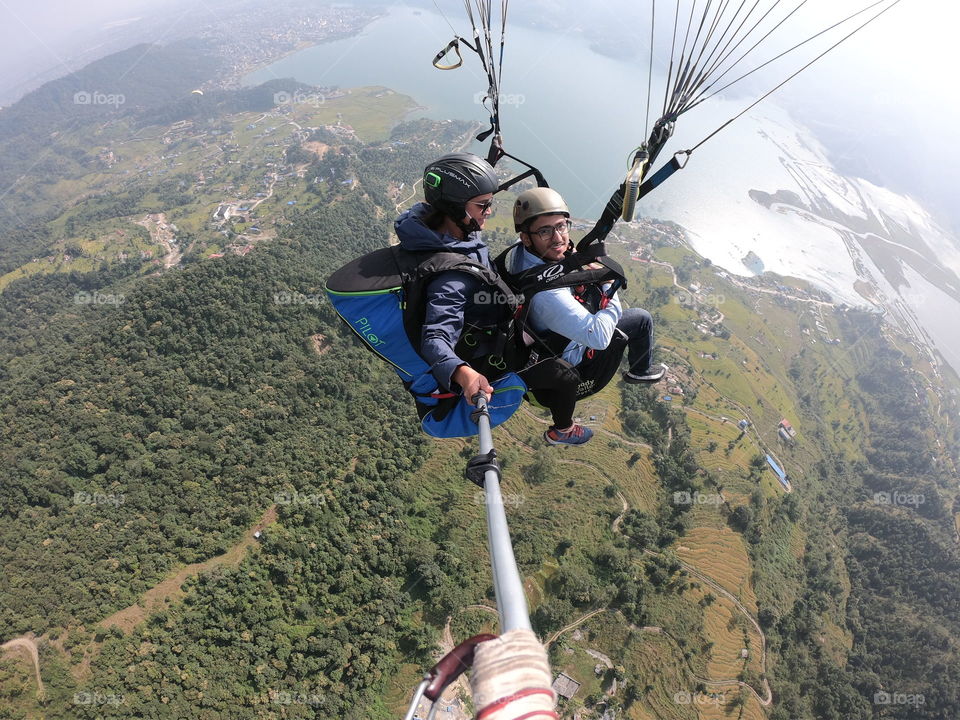 Me Paragliding over the city of Pokhara and lake Phewa. Sharing my first ever Paragliding experience.