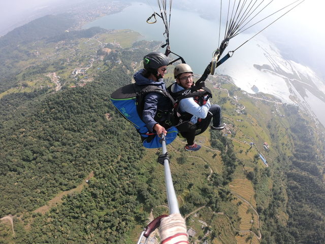 Me Paragliding over the city of Pokhara and lake Phewa. Sharing my first ever Paragliding experience.