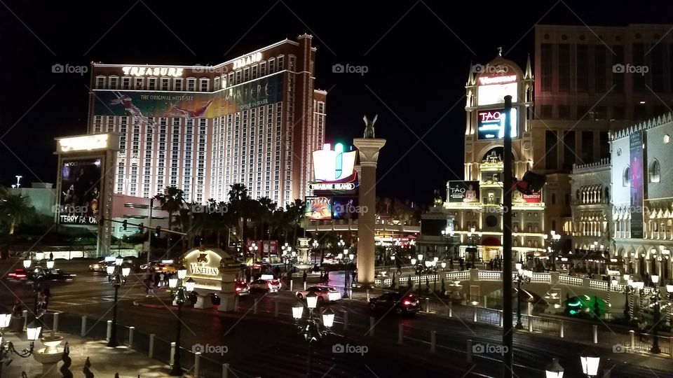 Nighttime Exterior of the Las Vegas Strip, featuring Treasure Island and the Venetian
