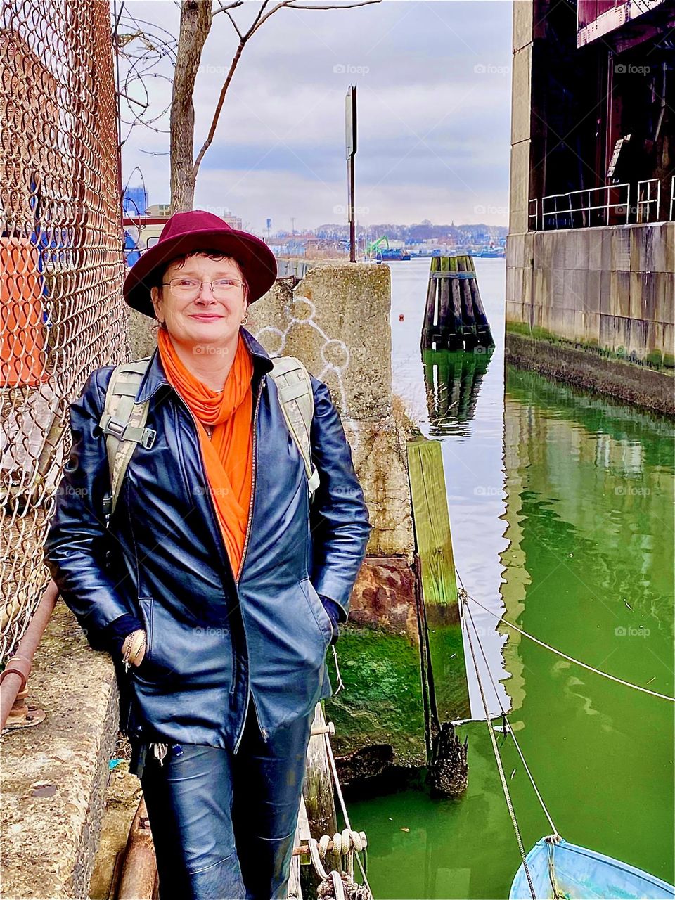 December 31, 2021, the last day of the year and I am on my way home along the wooden plank walkway at the waterside of Newtown Creek in LIC, Queens, NY. A nice man offered to take my picture and I am very happy with the result. Hypnotic Productions