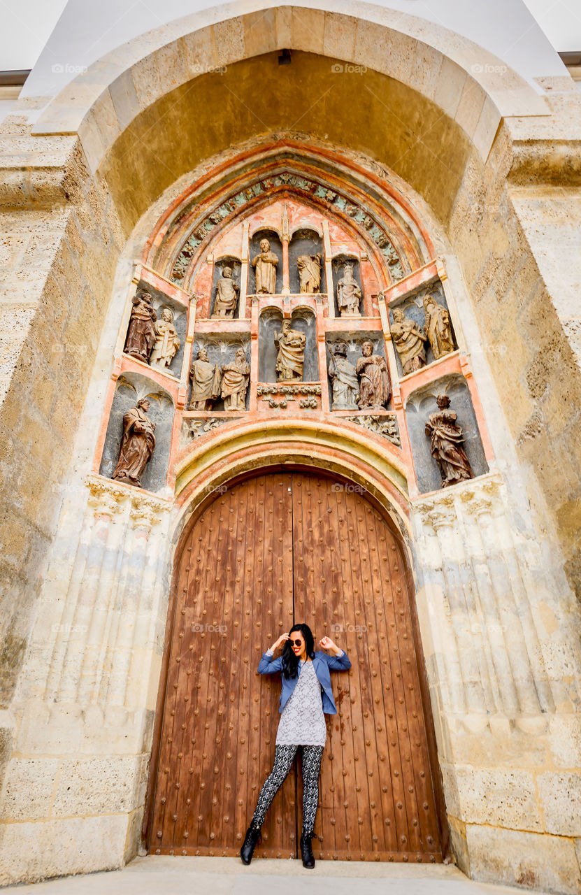 Beautiful woman standing in front of door