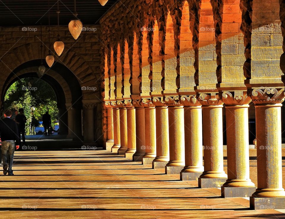 Architecture At Sunset. Classical Arches And Pillars At Sunset
