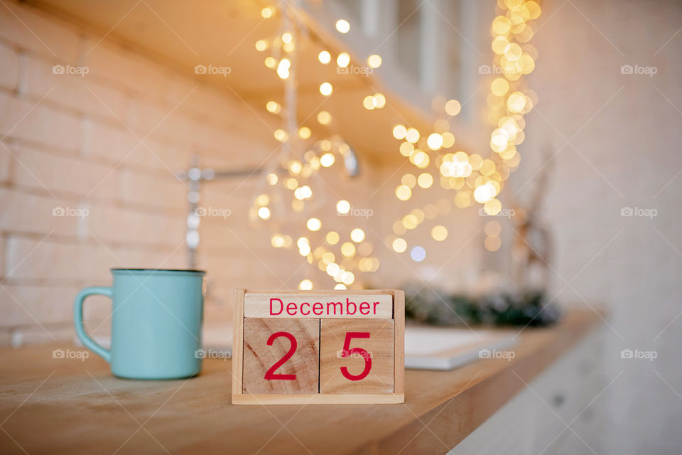 Christmas background with wooden block calendar with the date of December 25