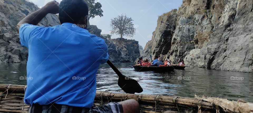 This place is Hogenakkal falls, a waterfall in South India on the Kaveri river on the border between Dharmapuri district of Tamil Nadu and Chamrajnagar district of Karnataka. Here you can enjoy bathing in falls, coracle ride and body massage too.
