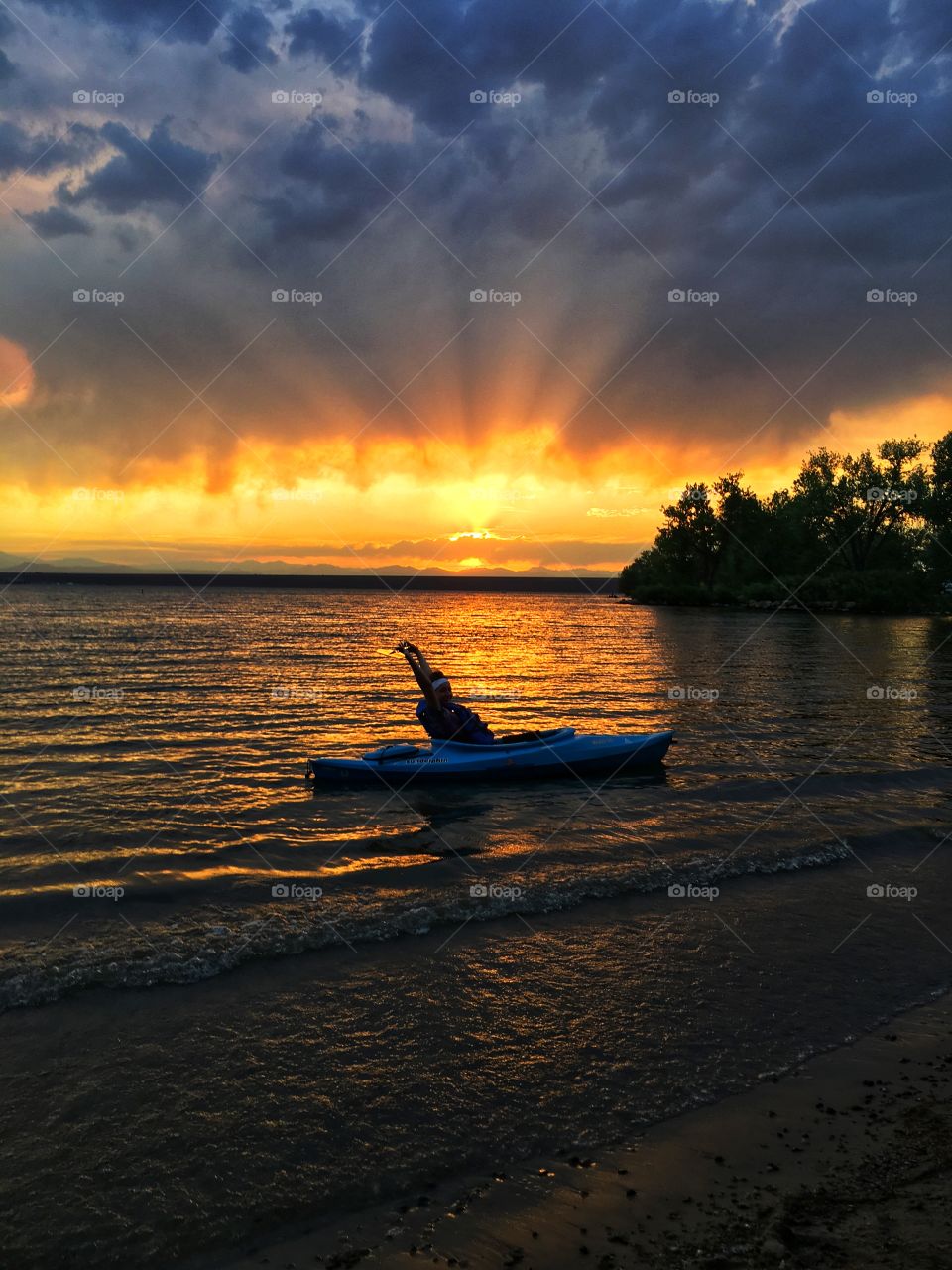 Joyful end to a afternoon of kayaking with gorgeous sunset in the background.