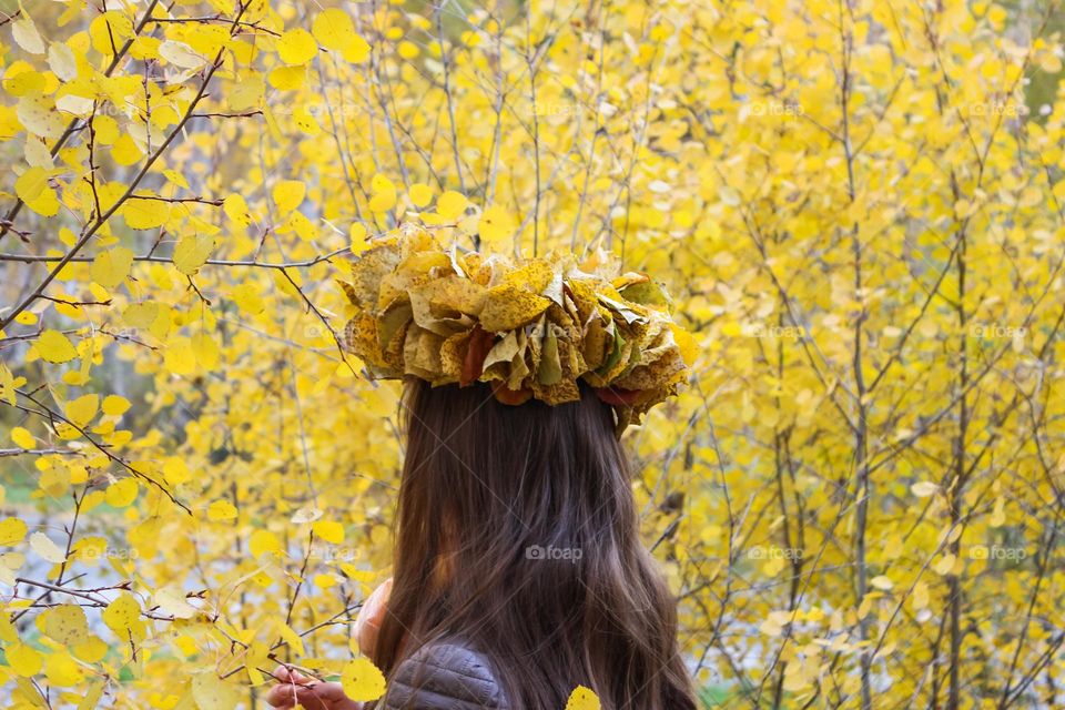 Girl in yellow leaves