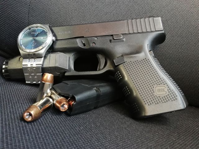Police watch and a Glock pistol