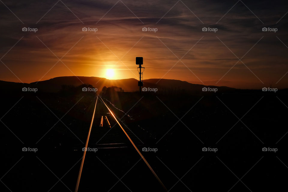 Rural train track at sunset. 